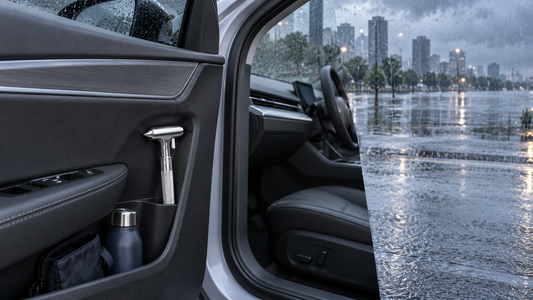 Silver Tesheer car escape hammer stored in a front door pocket during rainy flood preparedness