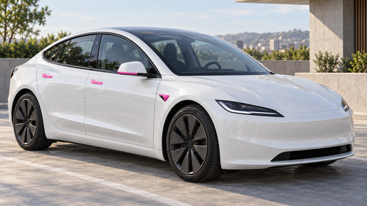 Fuchsia-pink door handle, side camera and mirror trim accessories on a white Model 3 Highland