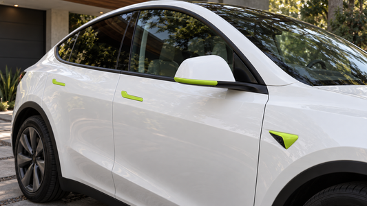 Glossy green Tesheer handle, mirror, and HW4 camera accents on a pearl-white Model Y Juniper