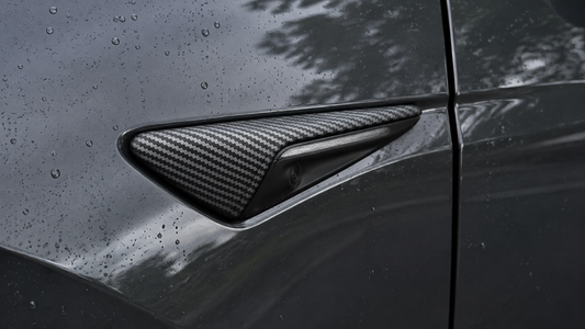 Matte carbon fiber style HW3 side camera cover installed without blocking the lens
