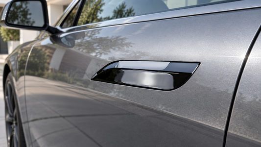 Glossy black Tesheer door handle trim installed around an extended silver Model S handle with even clearance
