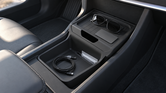Black TPE organizer holding a cable, sunglasses and small items in a Model Y Juniper Standard lower center console
