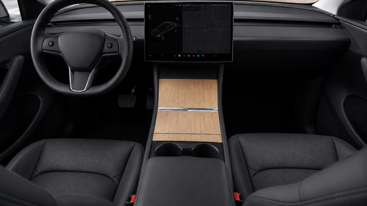 Natural wood-grain wrap installed on three center-console panels in a black 2025–2026 Tesla Model Y Juniper interior