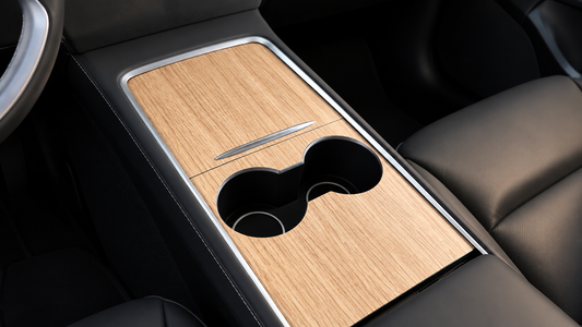 Tesheer light wood-grain center console wrap installed in a compatible Tesla Model 3