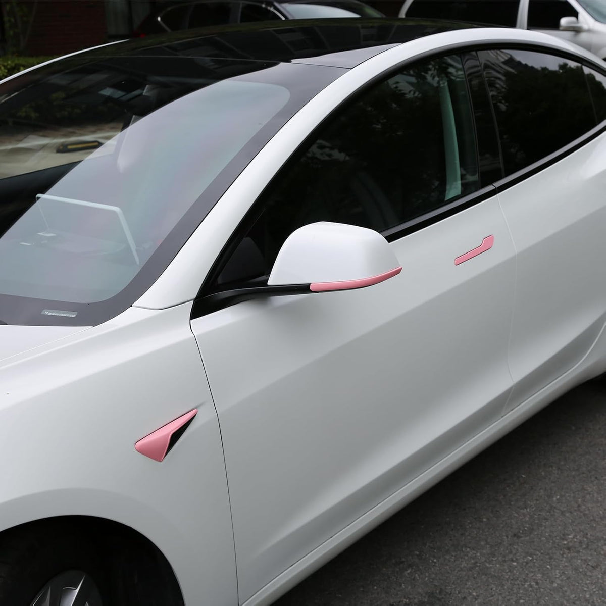 Peel-and-stick pink exterior accessory installation for Model Y HW3