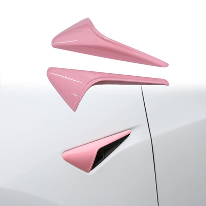 Pink HW 4.0 camera cover on Tesla Model Y side fender camera